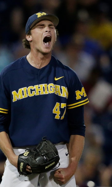 Michigan rides Henry's 3-hitter to 2-0 win over FSU at CWS